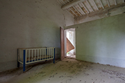 Bauernhaus Caivoli - Schlafzimmer mit Kinderbett
